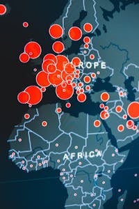 Vector image of digital map representing Africa and Europe continents with wavy lines and bright round marks on device screen